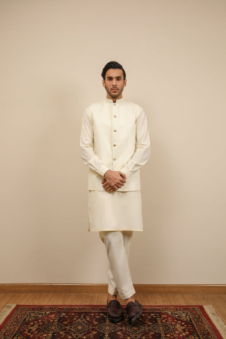 Muraqsh Ready To Wear Solids Bosky Men Bosky White Kurta Trouser with Off White Jamawar Waistcoat MUR-BWKTW - Summer Collection