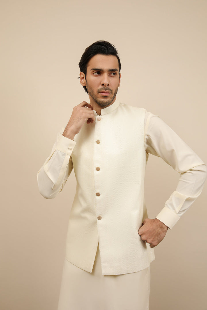 Muraqsh Ready To Wear Solids Bosky Men Bosky White Kurta Trouser with Off White Jamawar Waistcoat MUR-BWKTW - Summer Collection